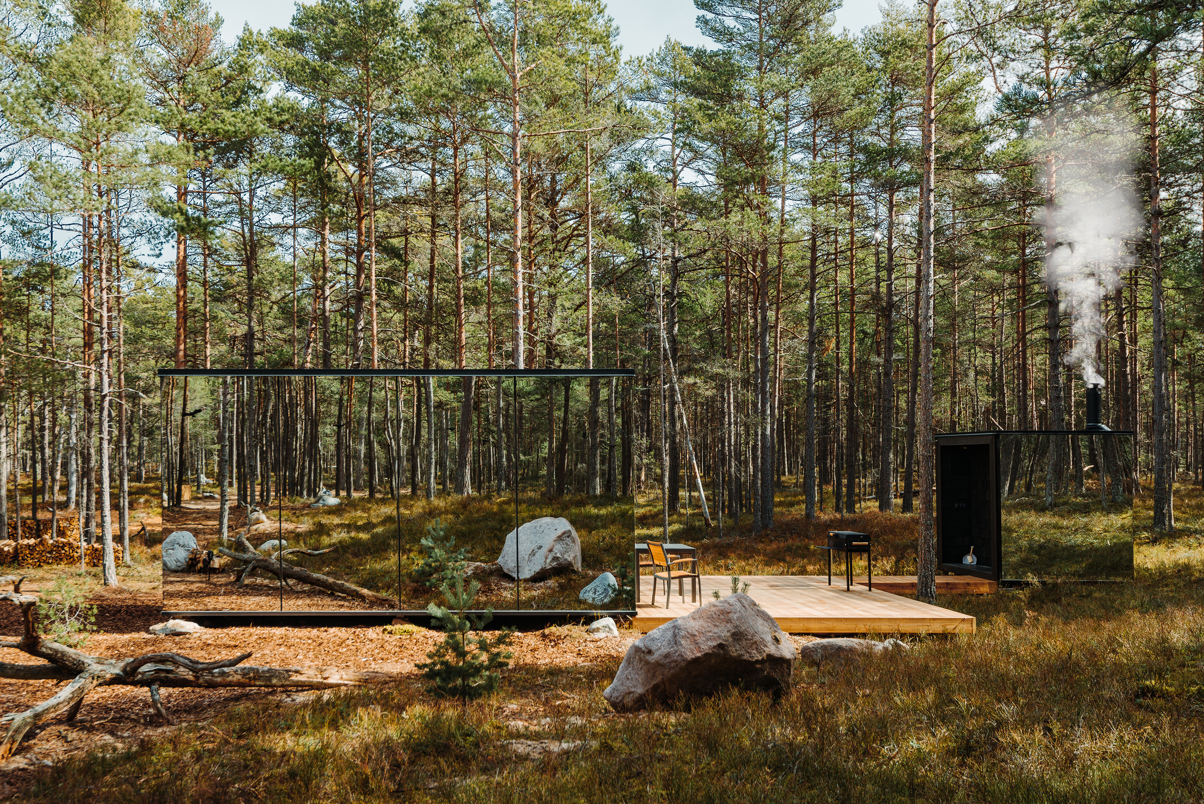 a cabin in the middle of a forest with smoke coming out of the chimney